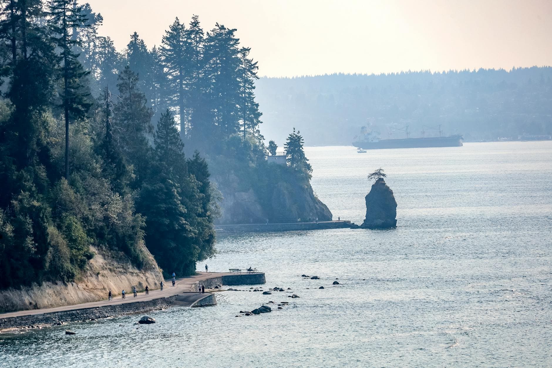 Stanley Park seawall coastal path with Siwash Rock and ocean views in Vancouver