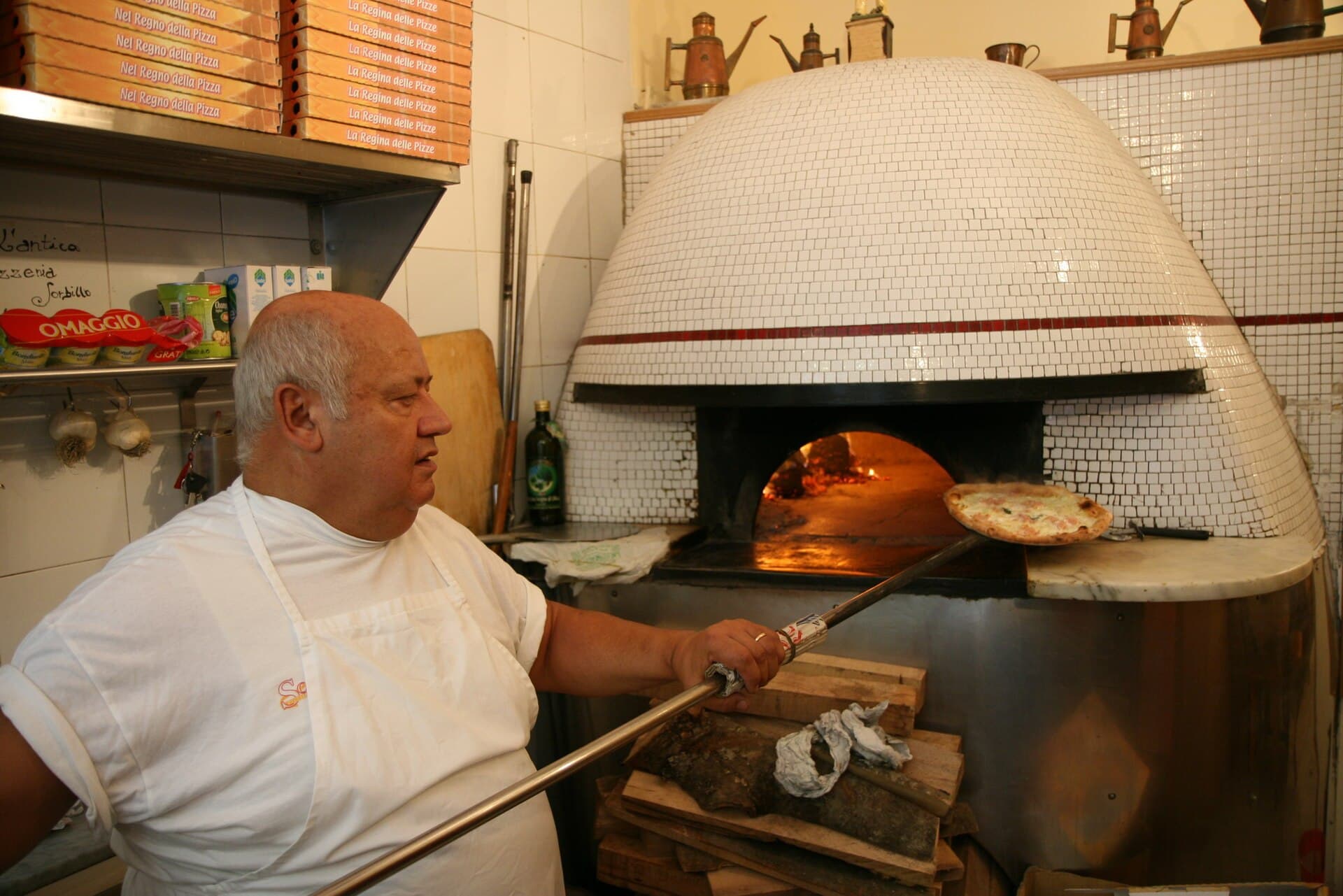 A wood-fired pizza oven at Pizzeria Sorbillo in Naples